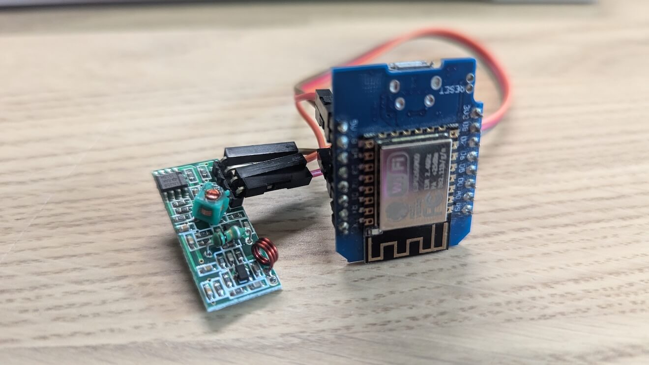 A Wemos microcontroller next to a simple RF receiver